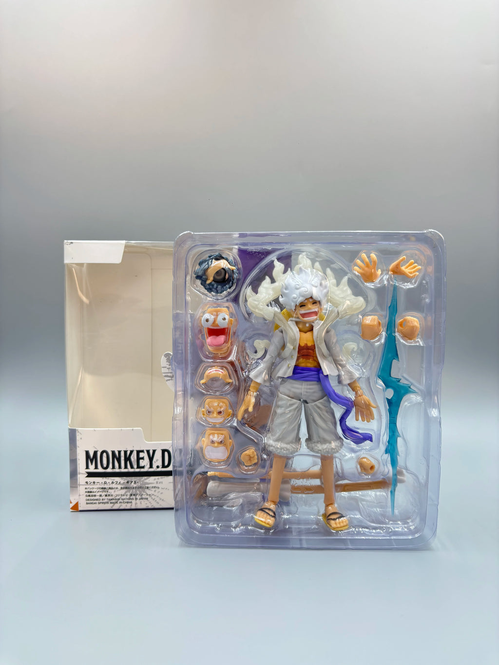 Bandai One Piece Luffy Gear 5 Nika Action Figure; Sun God White Hair Luffy with Multiple Replaceable Hands and Expressions; Boxe